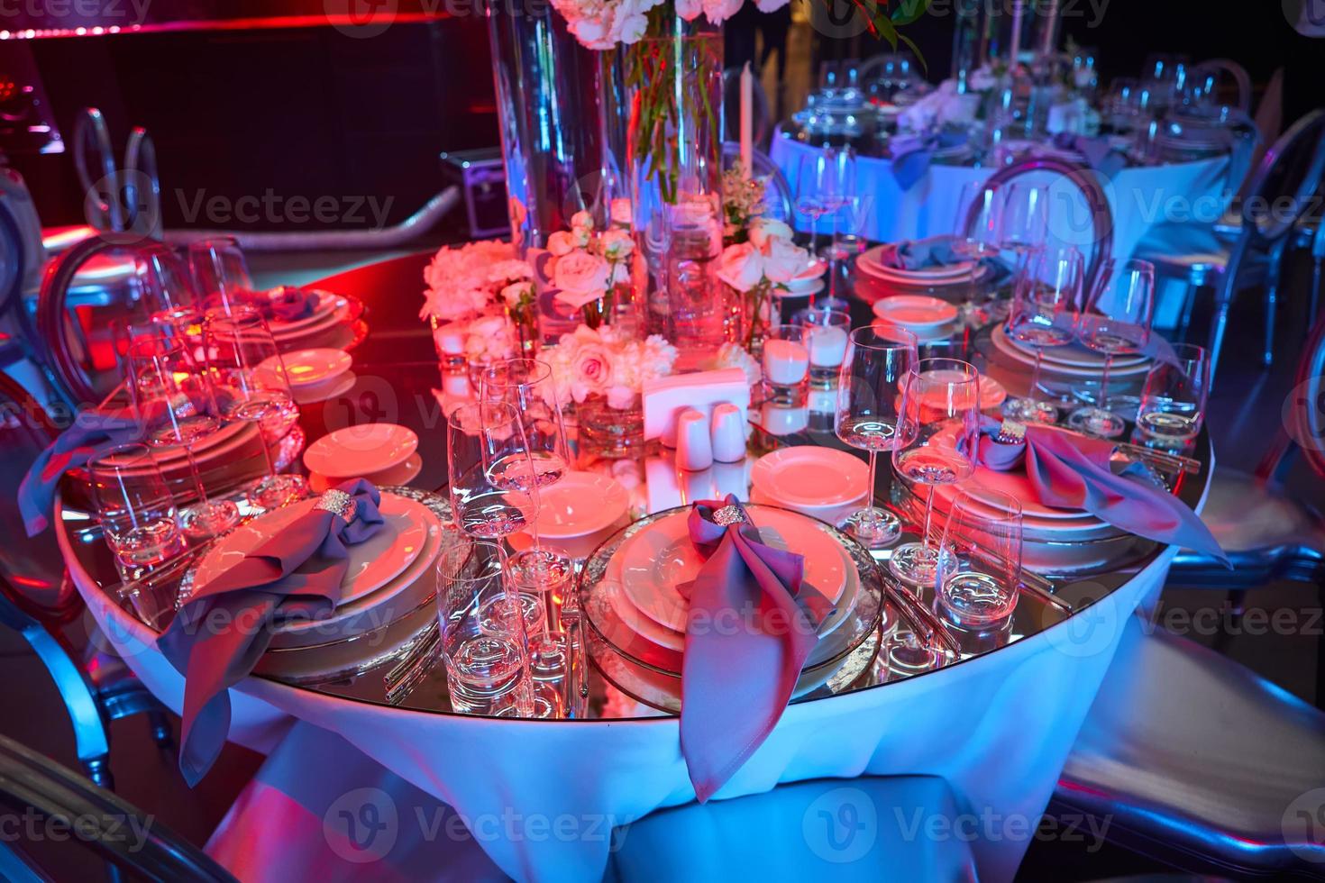Table setup in red light. Ready to event. Shallow dof photo