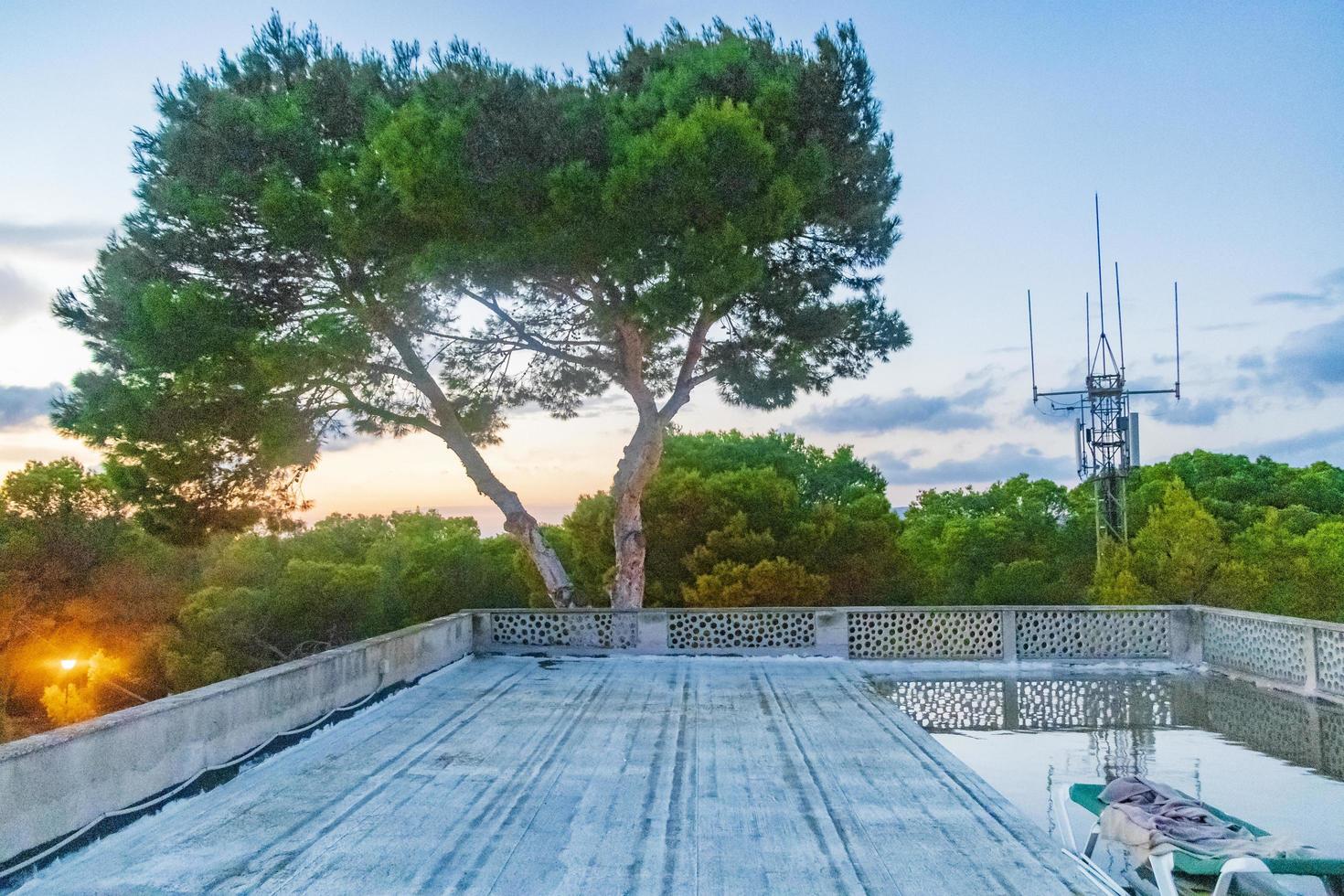 Sunset at roof terrace with a sun lounger in Mallorca. photo