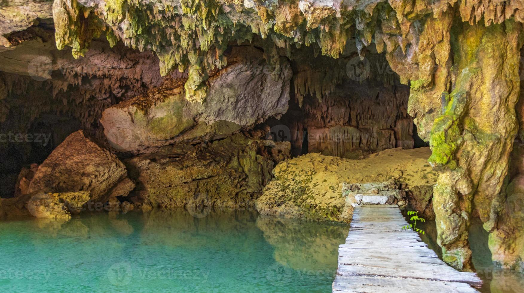 Amazing blue turquoise water and limestone cave sinkhole cenote Mexico. photo