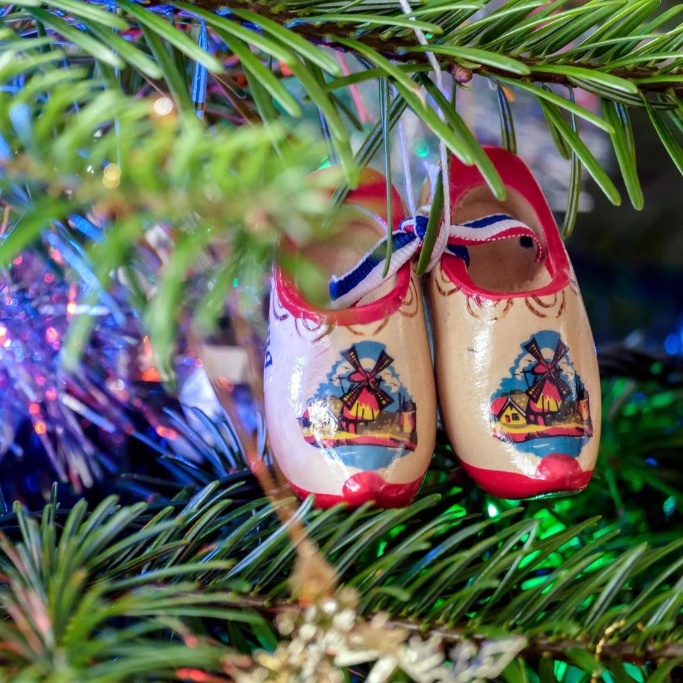 East Grinstead, West Sussex, Uk, 2016. Moon Pair of Dutch Clogs on a Christmas Tree photo