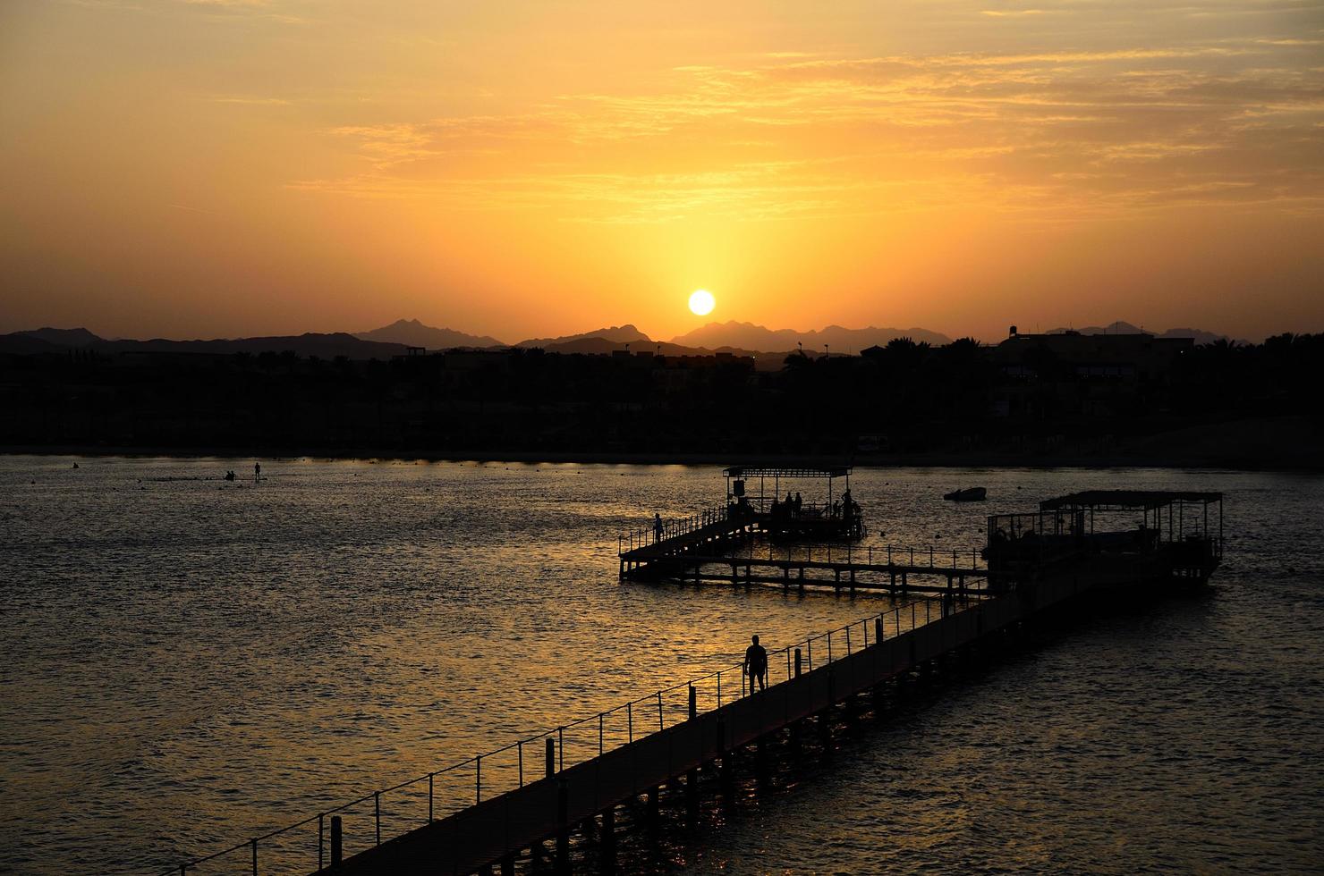 jetty to coral reef at sunset photo