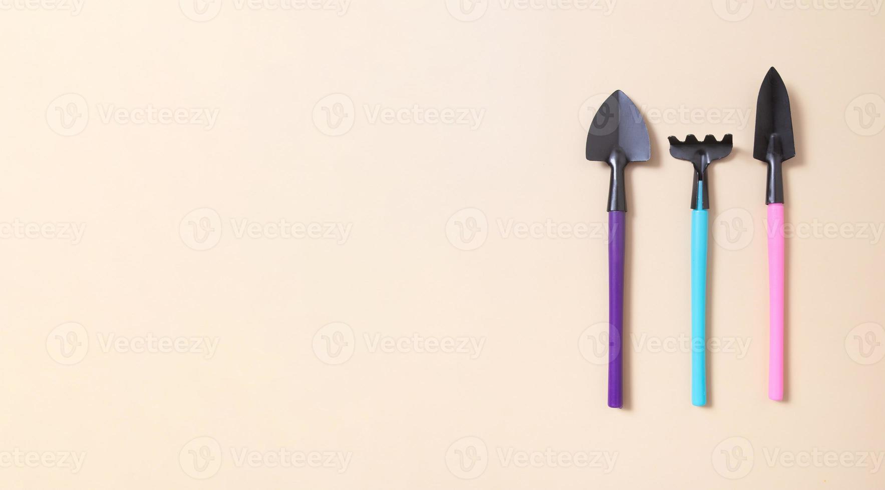 Banner with shovels and rakes for gardening. flat lay. The concept of spring planting with copy space photo
