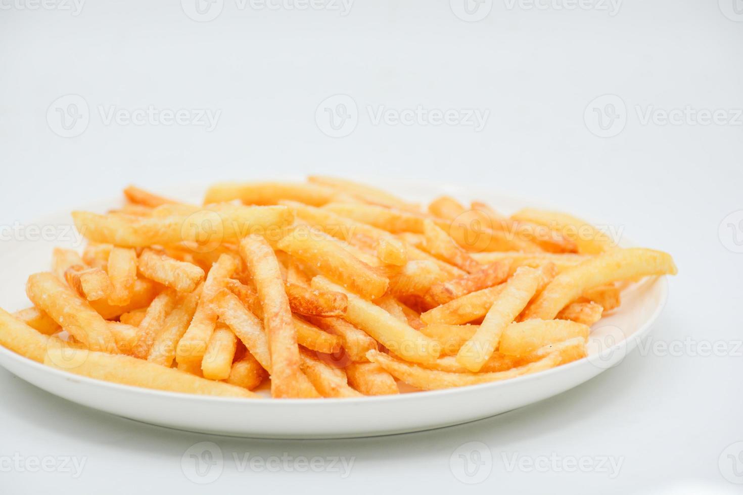 French fries on white dish and white background. photo