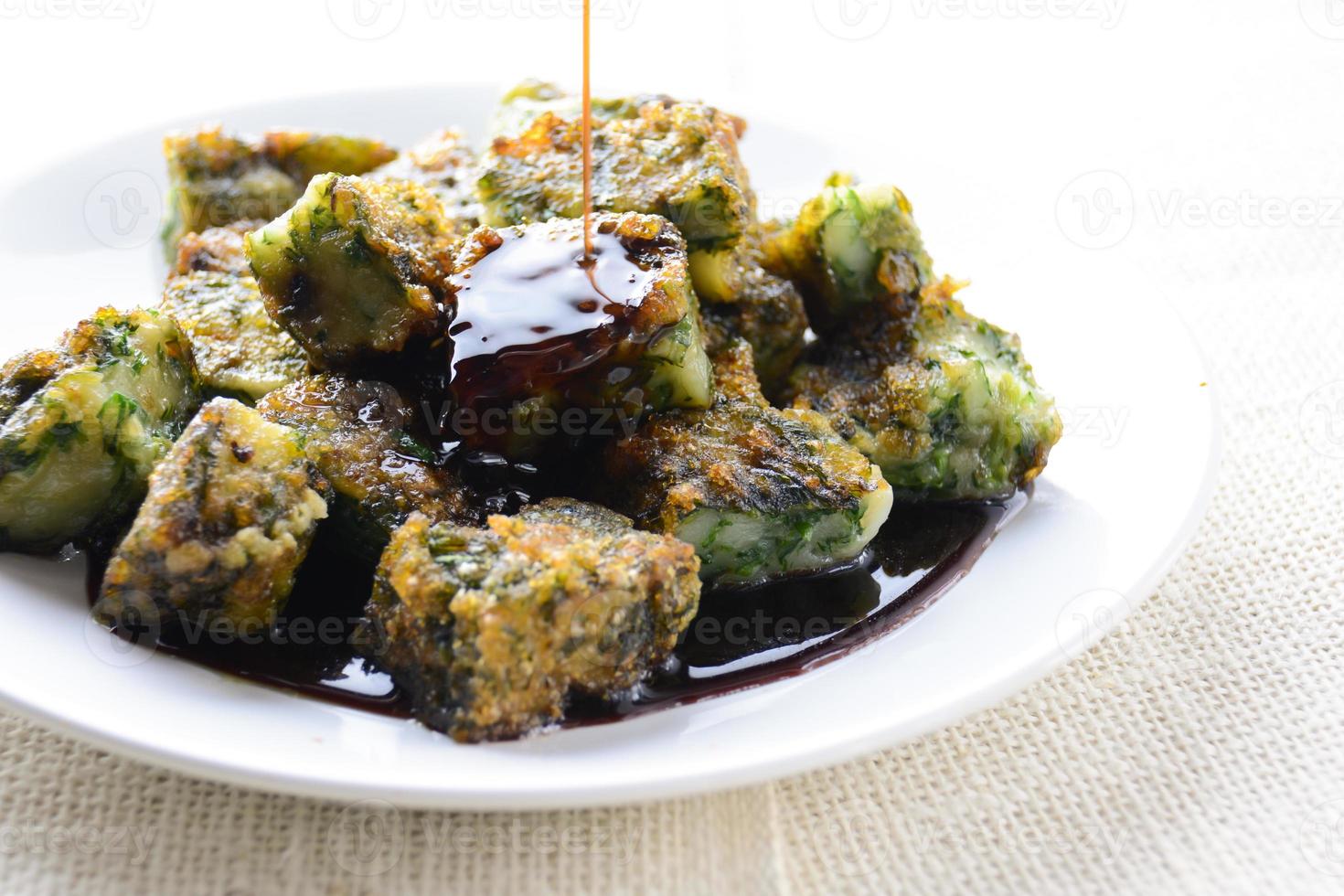 Deep fried Chinese Chive Dumplings, make for a great healthy and light snack appetizer, and consisting of chinese chives stuffed inside dumpling dough. photo