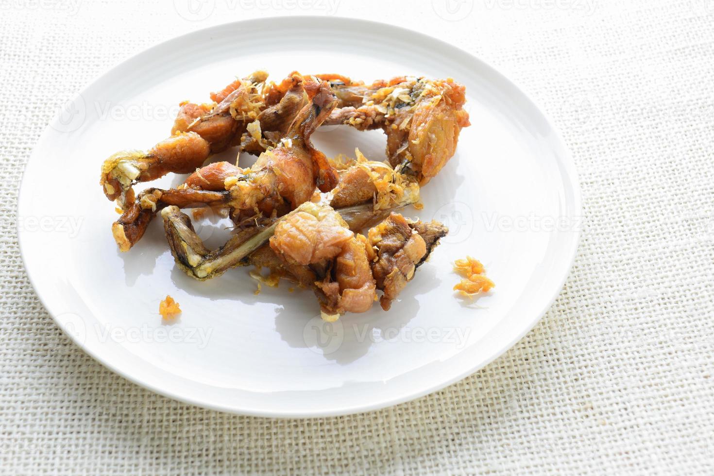 Crispy frogs legs with garlic and tarragon. Quick and easy frog leg recipe. photo