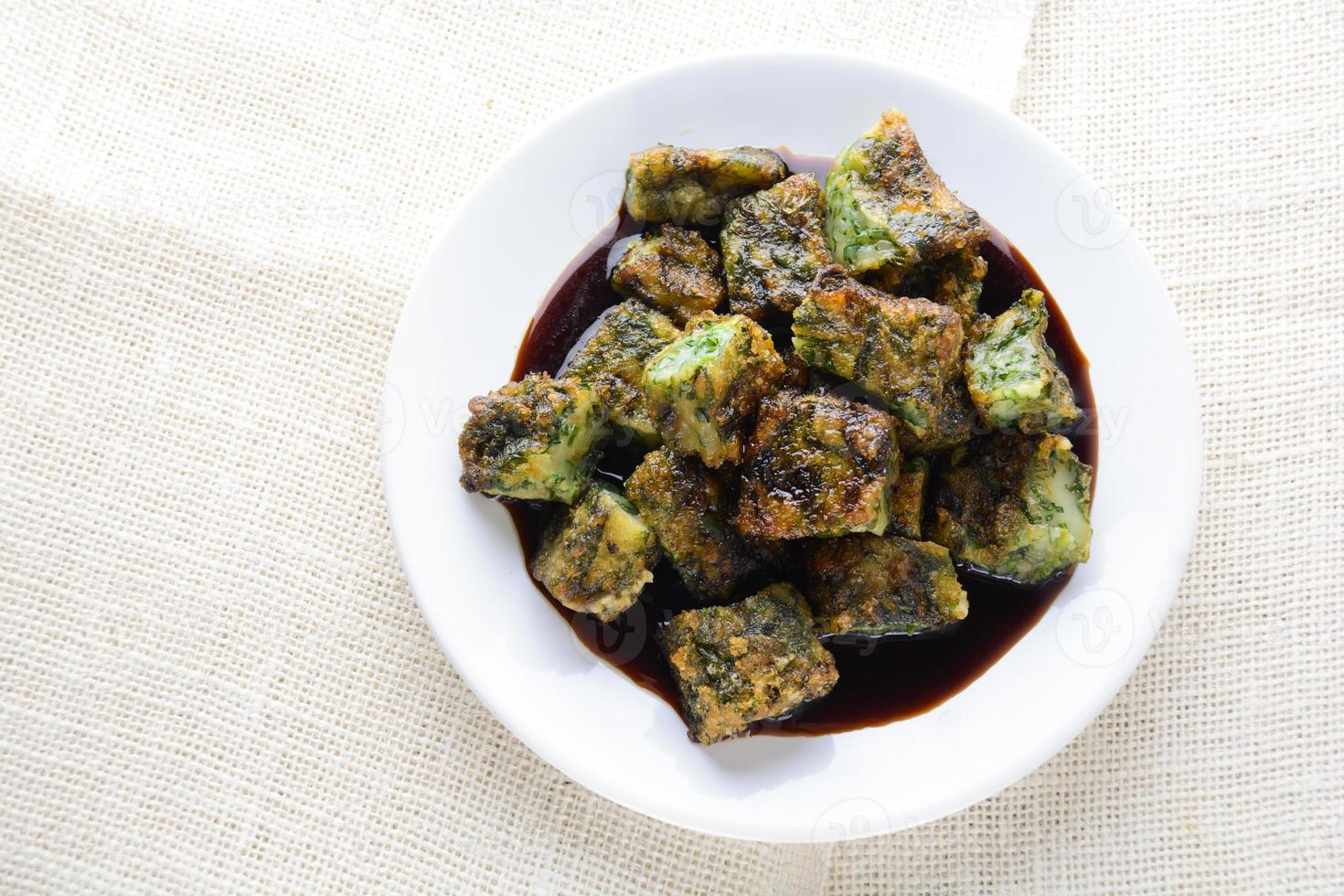 Deep fried Chinese Chive Dumplings, make for a great healthy and light snack appetizer, and consisting of chinese chives stuffed inside dumpling dough. photo