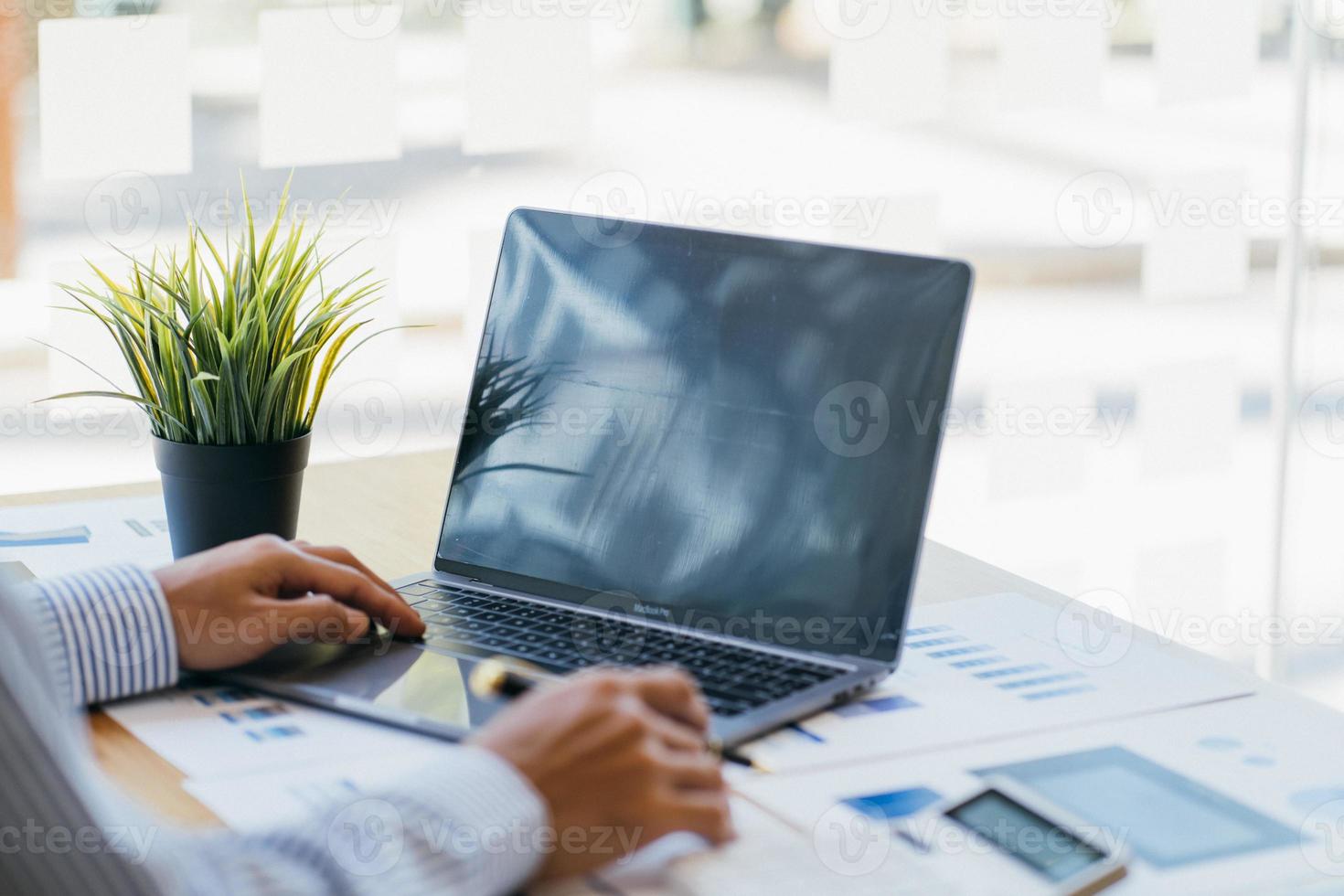 Financial businessman analyze the graph of the company's performance to create profits and growth, Market research reports and income statistics, Financial and Accounting concept. photo