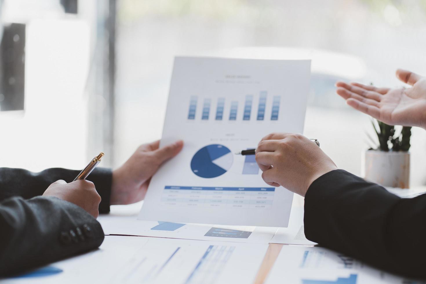 business advisor meeting to analyze and discuss the situation on the financial report in the meeting room.Investment Consultant,Financial Consultant,Financial advisor and accounting concept photo