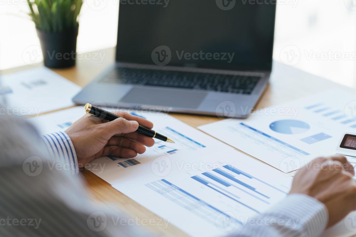 Financial businessman analyze the graph of the company's performance to create profits and growth, Market research reports and income statistics, Financial and Accounting concept. photo