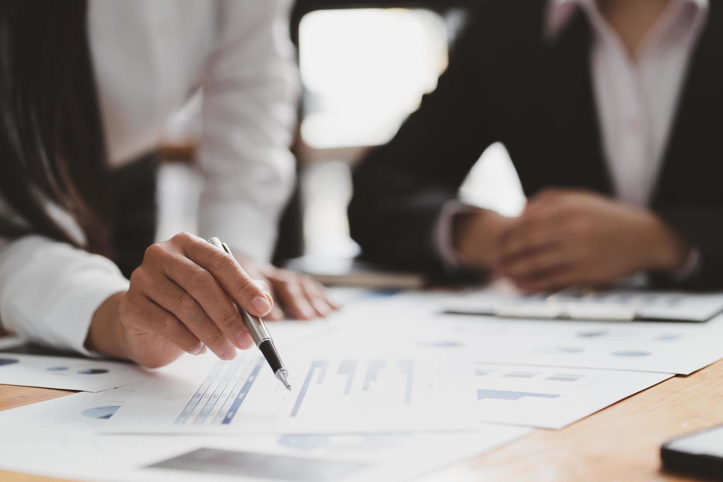 Businessman meeting and working with financial report, talking about business plan for investment, finance analysis concept photo