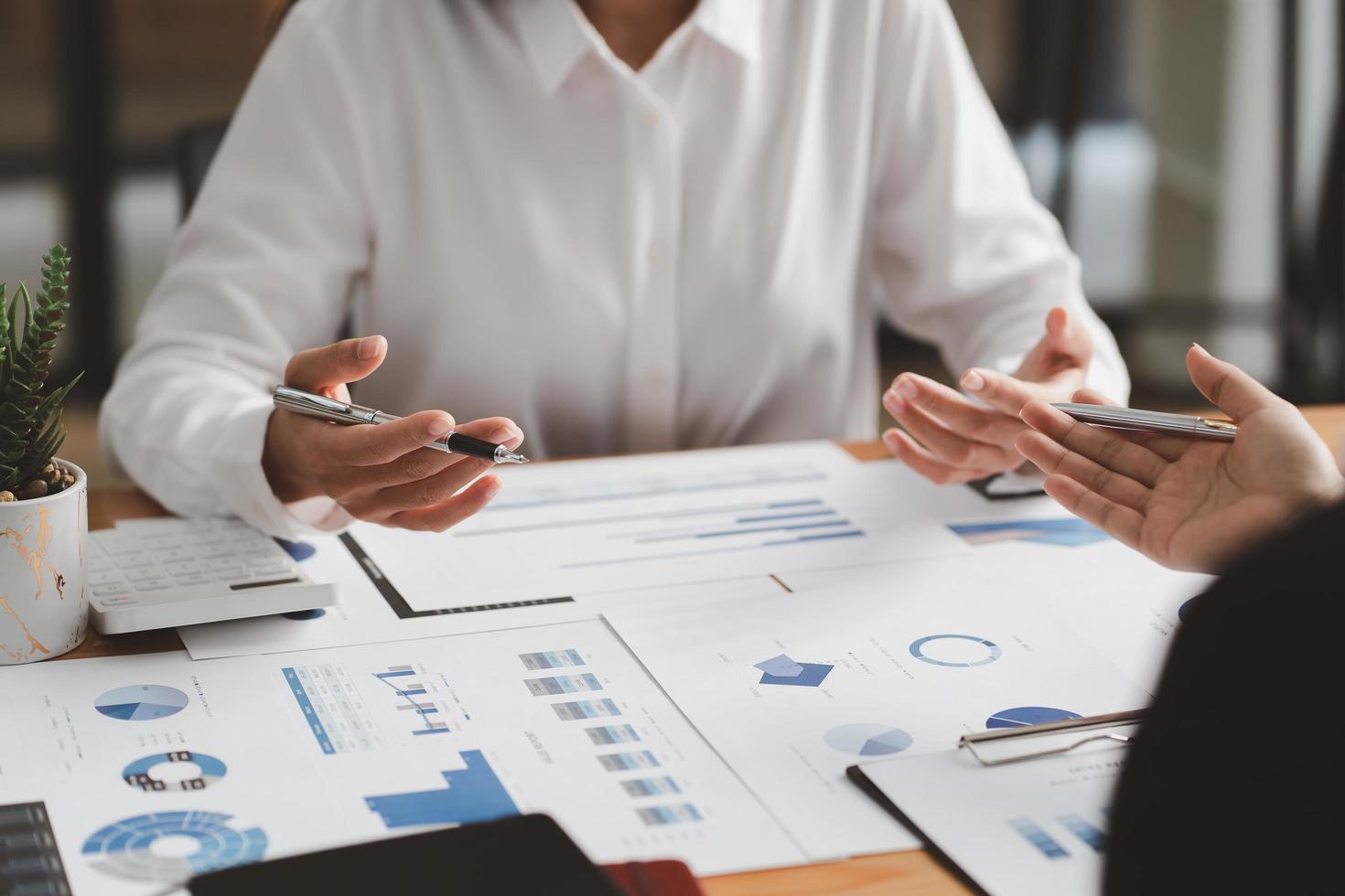 Businessman meeting and working with financial report, talking about business plan for investment, finance analysis concept photo