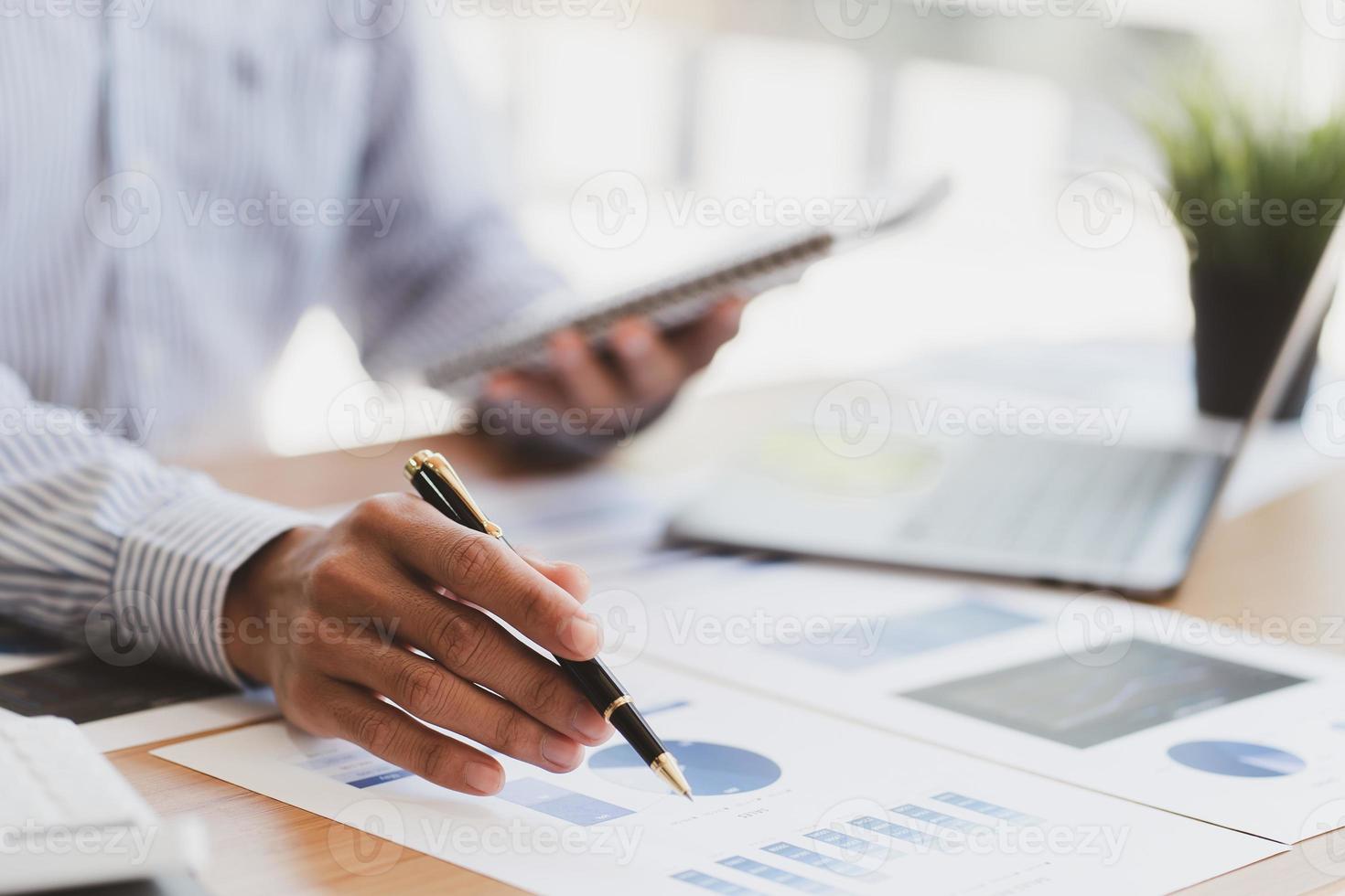 Businessman working with financial report, talking about business plan for investment, finance analysis concept. photo