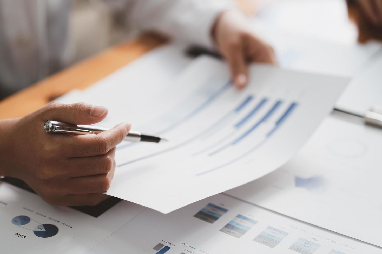 Businessman meeting and working with financial report, talking about business plan for investment, finance analysis concept photo
