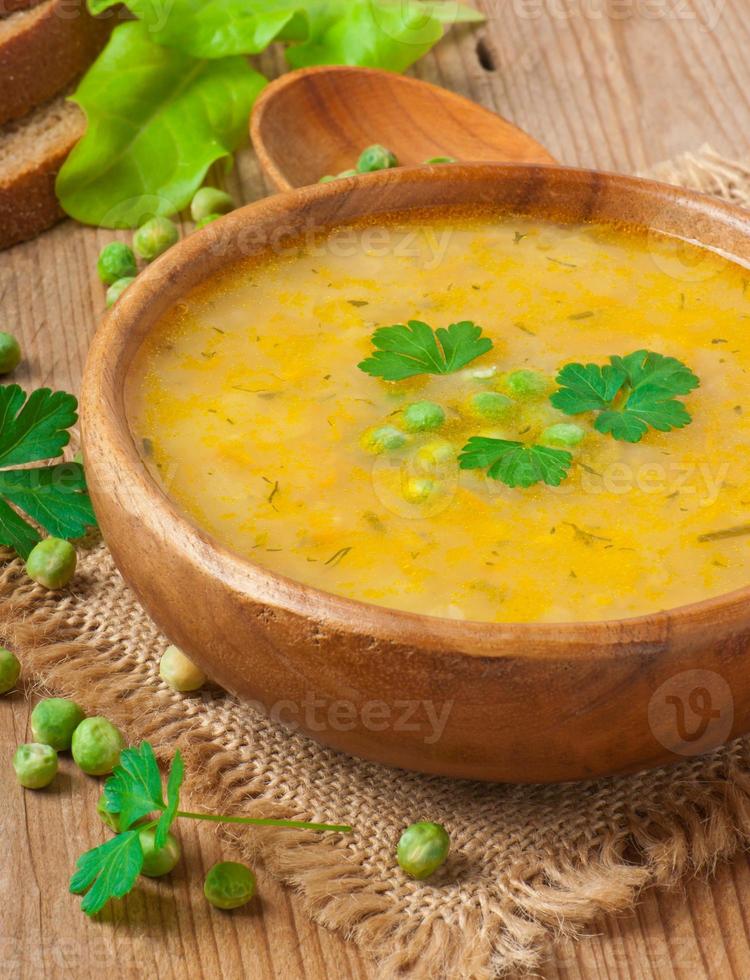 Traditional fresh pea soup in the bowl photo