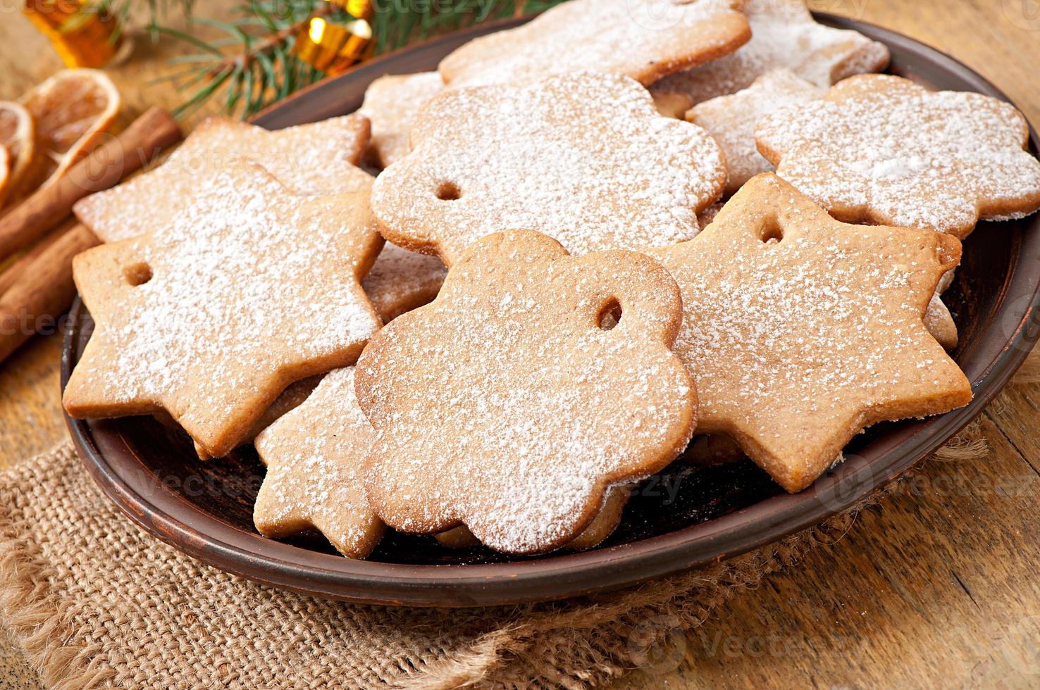 Homemade Christmas cookies sprinkled with powdered sugar photo