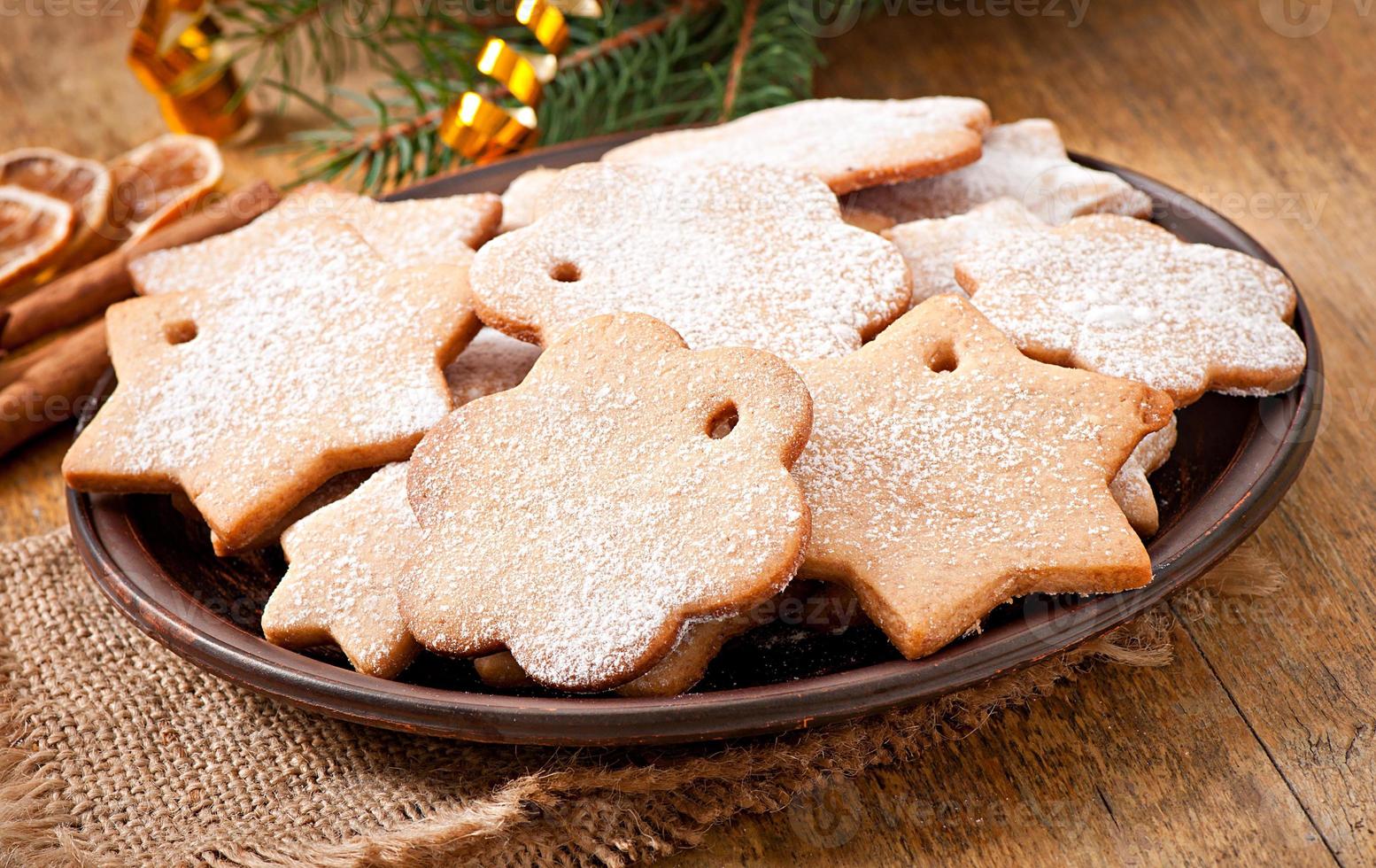 Homemade Christmas cookies sprinkled with powdered sugar photo