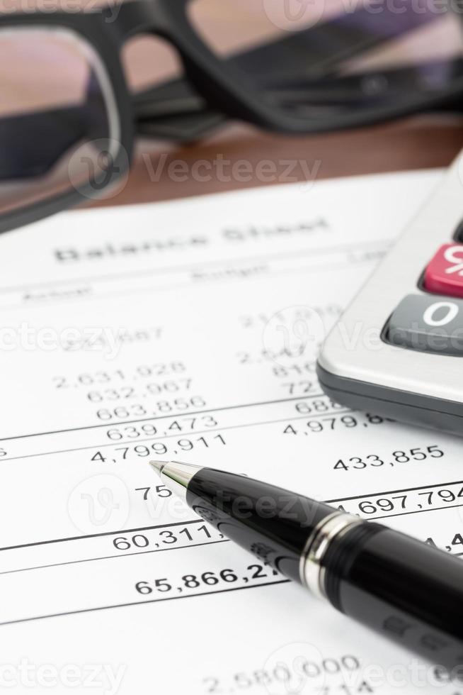 Balance sheet financial report focus at pen photo