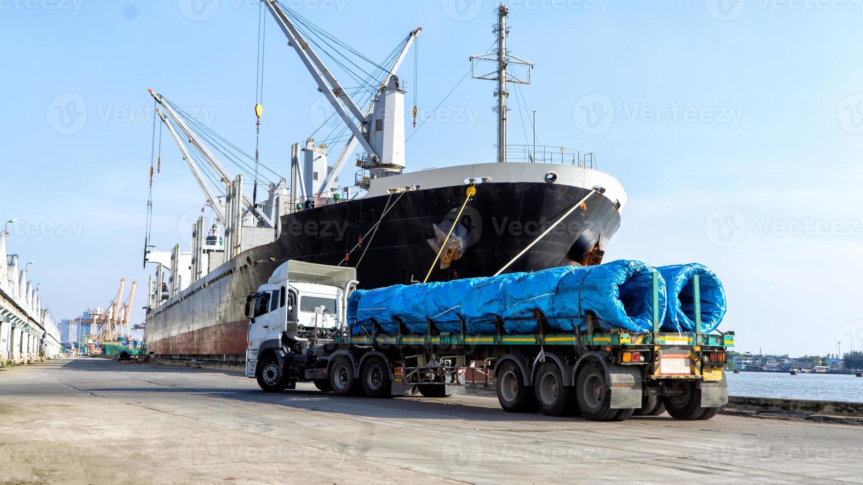 Container loading in a Cargo freight ship with industrial crane. Container ship in import and export business logistic company. Industry and Transportation concept. photo
