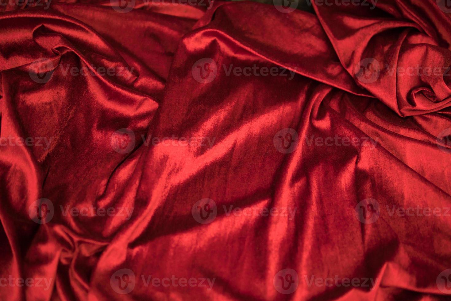 Fold soft waved red velour fabric textured background photo