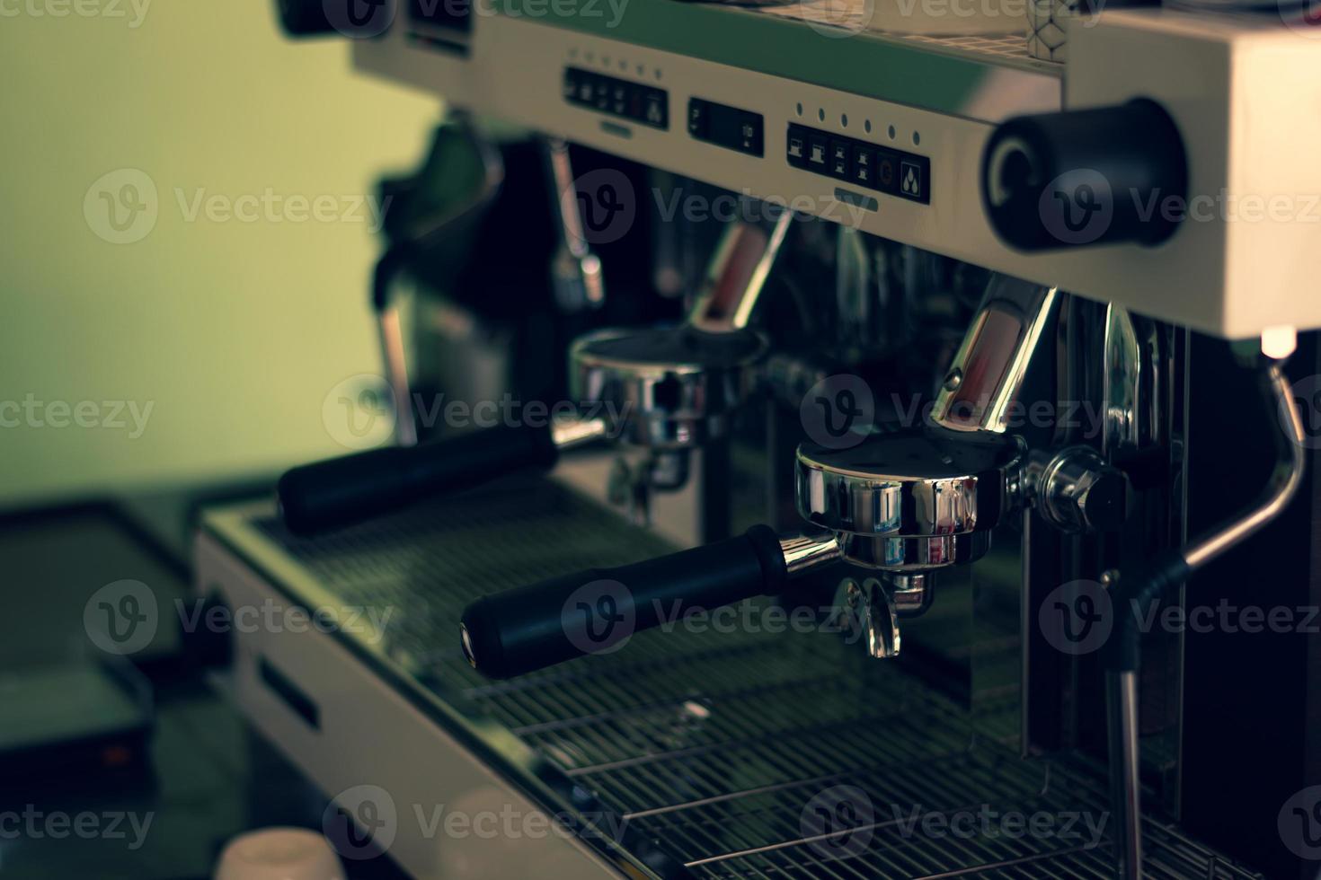 Close up nozzle of modern and automatic of coffee making machine. photo