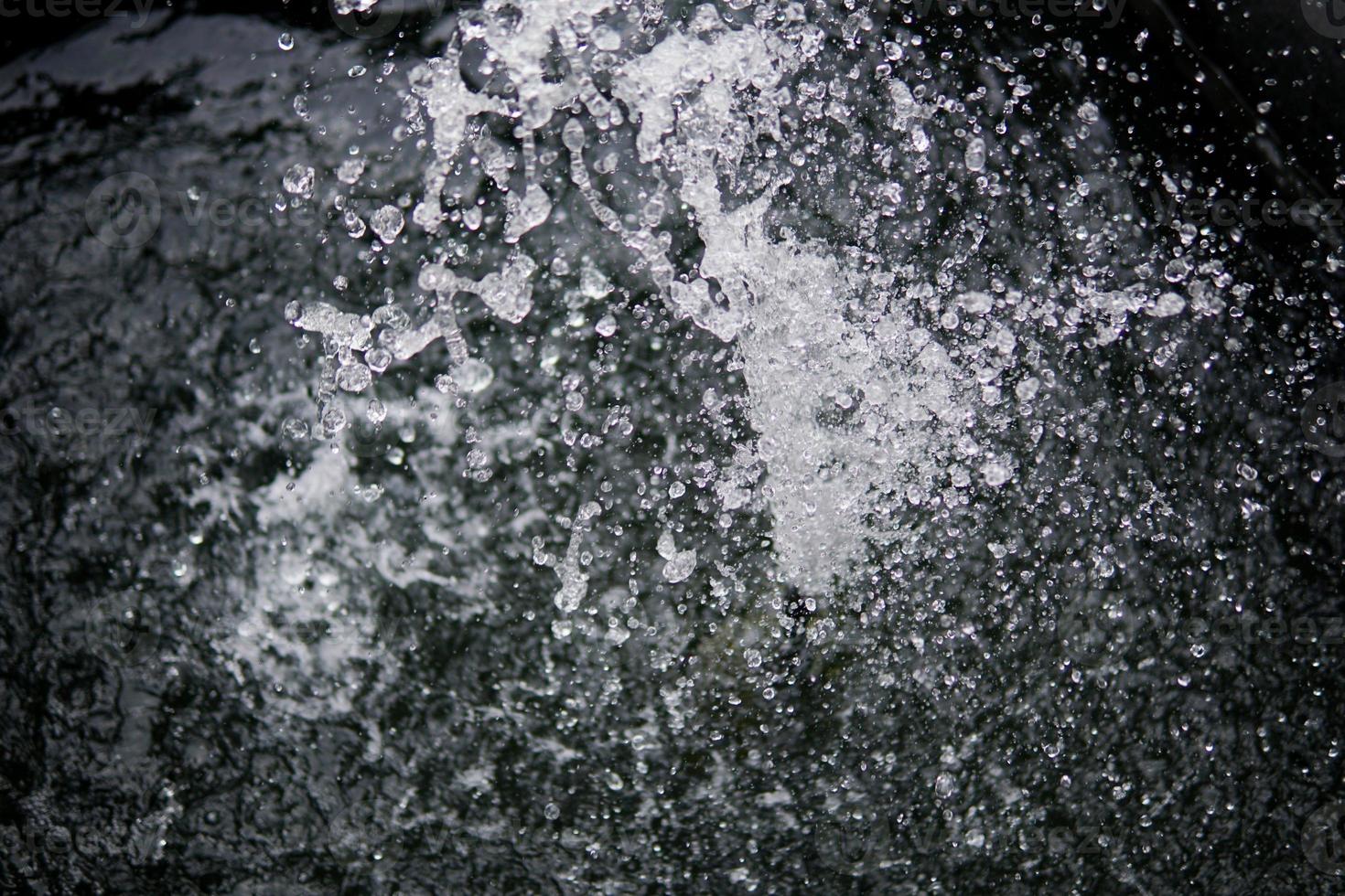 Water Splash on black background.Stylish water splash. Isolated on black background. photo