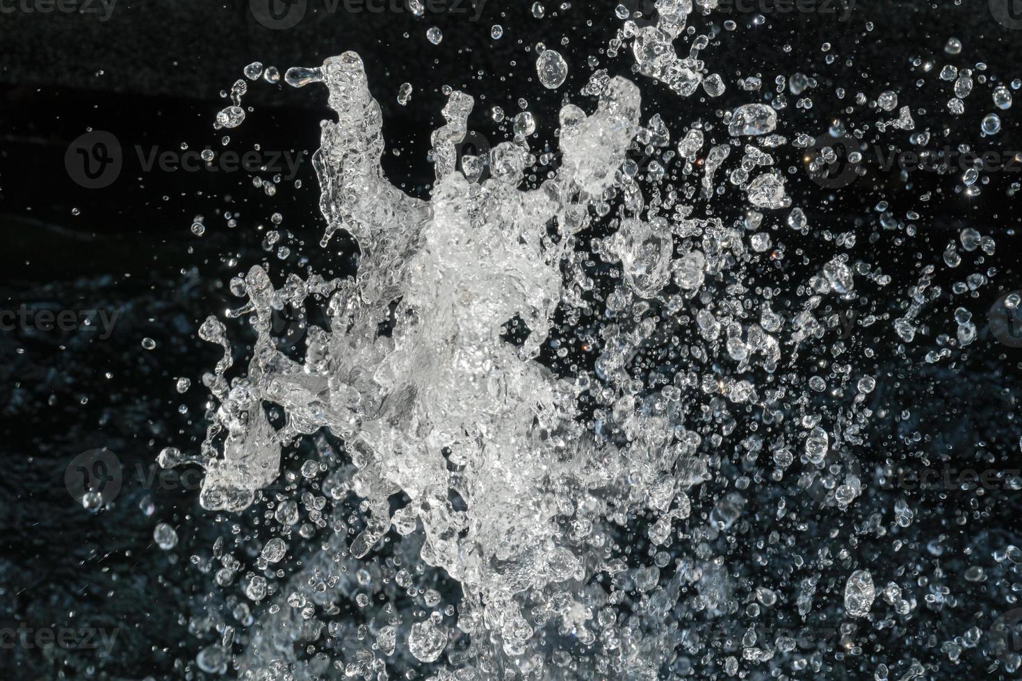 Water Splash on black background.Stylish water splash. Isolated on black background. photo