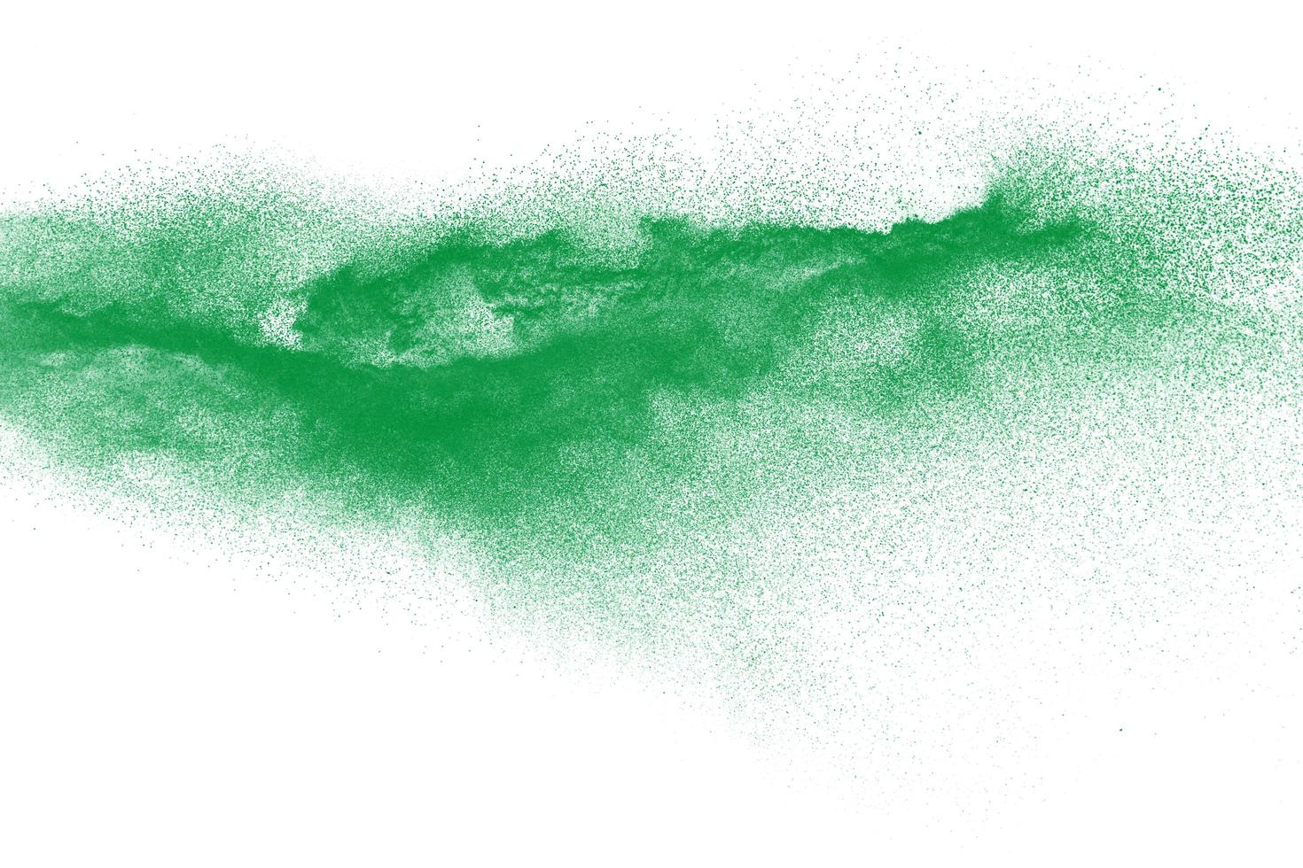 Green dust particles explosion on white background. Powder dust splash. photo