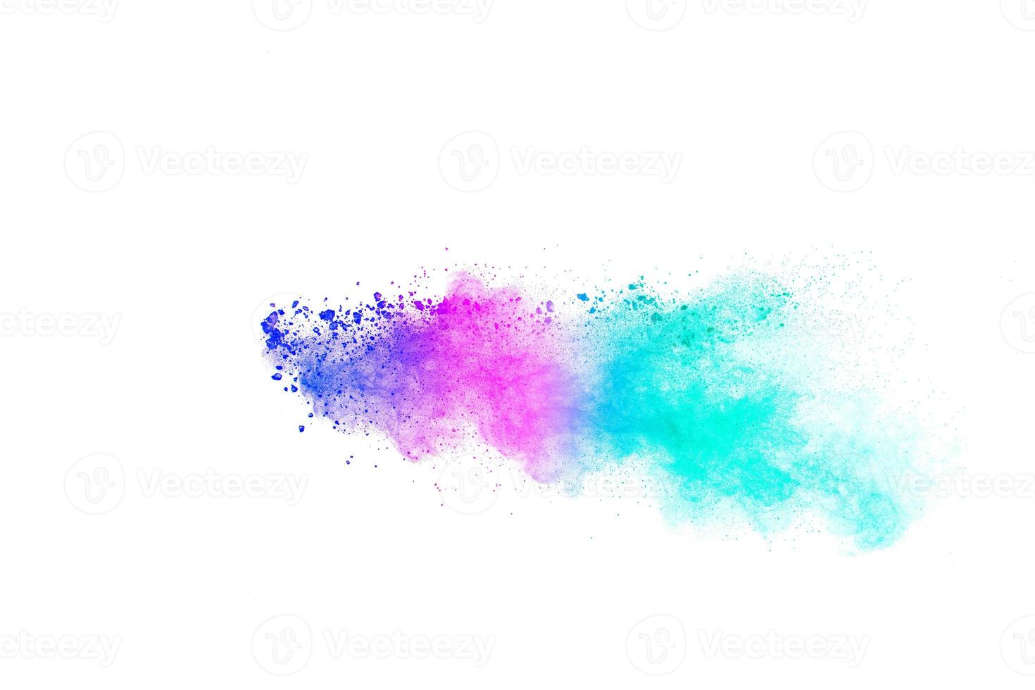 Multicolored particles explosion on white background. Colorful dust splatter. photo