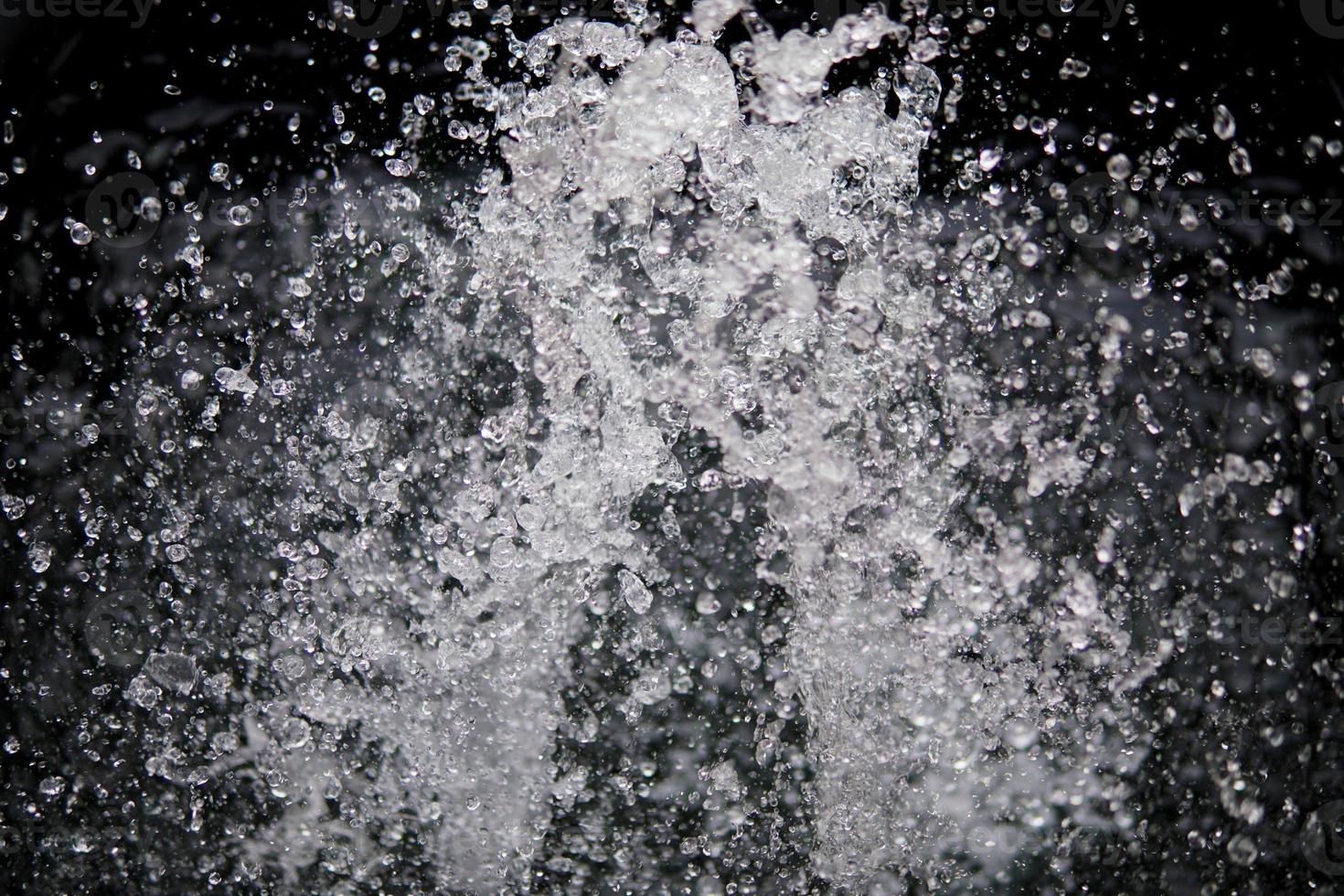 Water Splash on black background.Stylish water splash. Isolated on black background. photo