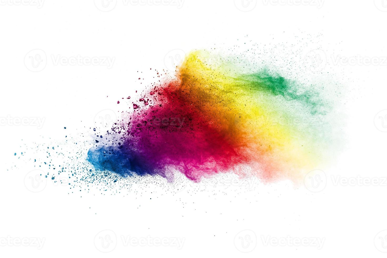 Multicolored particles explosion on white background. Colorful dust splattered. photo