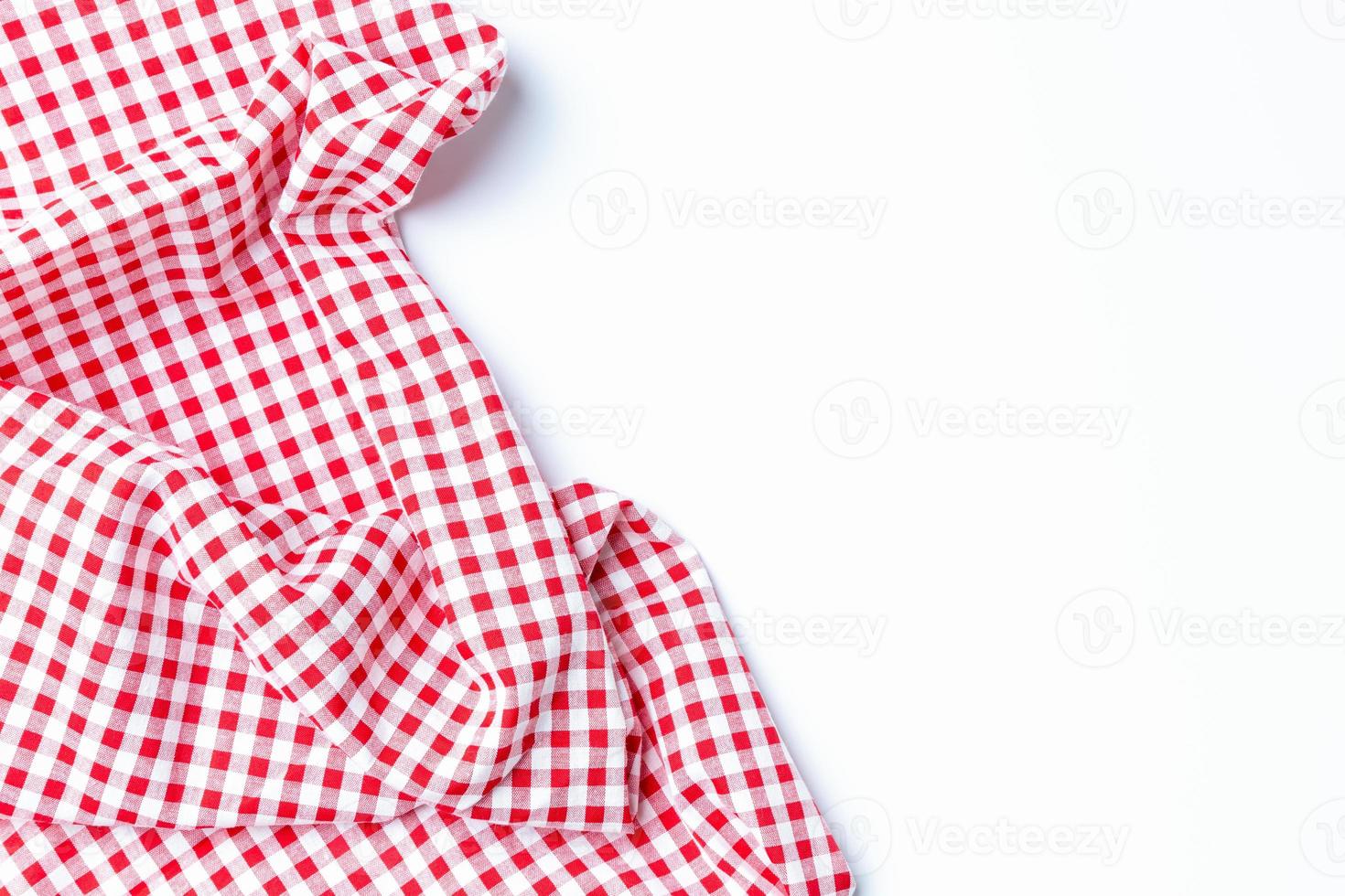 Top view napkin checkers red and white on a white background. Fabric crumpled red and white Isolated with copy space. photo