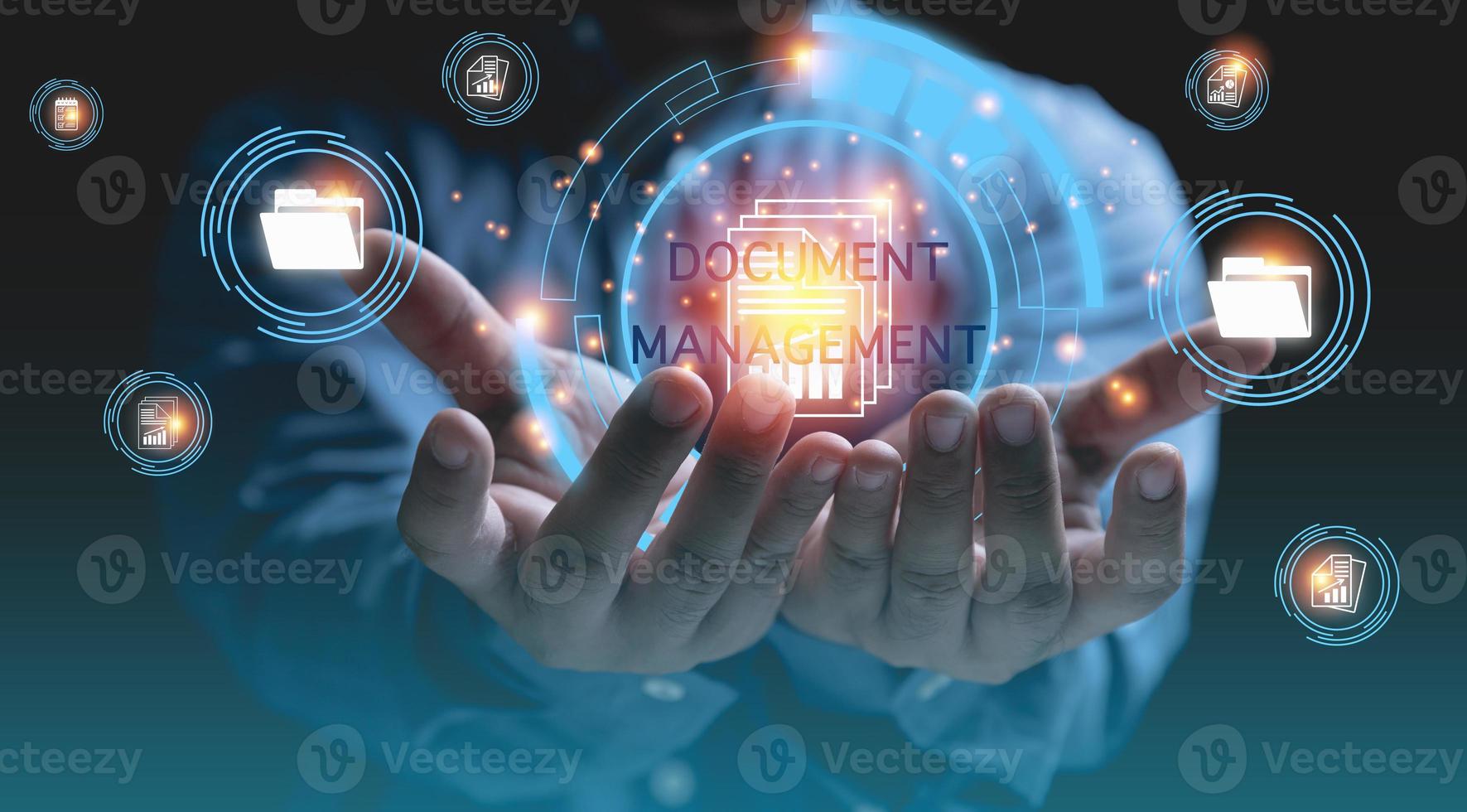 DOCUMENT MANAGEMENT SYSTEM. Technology digital internet online keep documents business for security. Businessman holding digital databases and corporate files and information on hands. photo