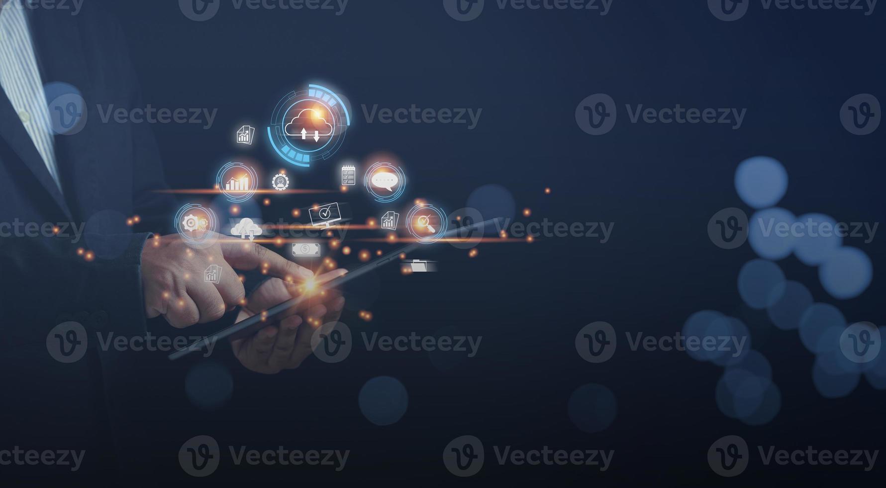 Businessman touching on a tablet cloud computing online and business icon for providing access to information and data global connection, innovation and technology. photo