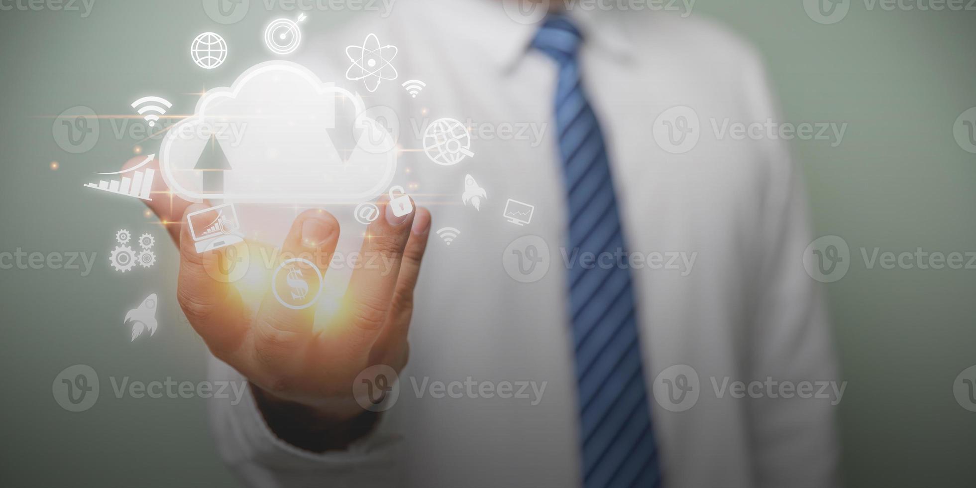 Businessman holding cloud computing online and business icon for providing access to information and data global connection, innovation and technology. Technology internet online, business concept. photo