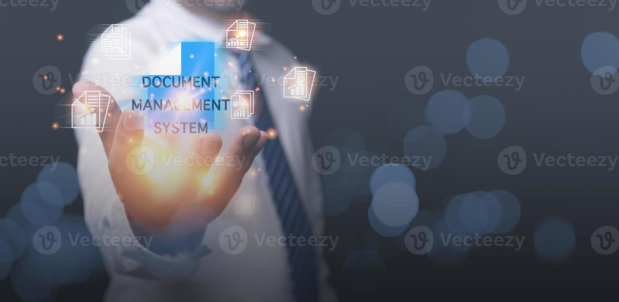 Document Management System. Businessman holding folder database and document icon. Management digital documentation online corporate files and information. Internet Technology Business  Concept. photo
