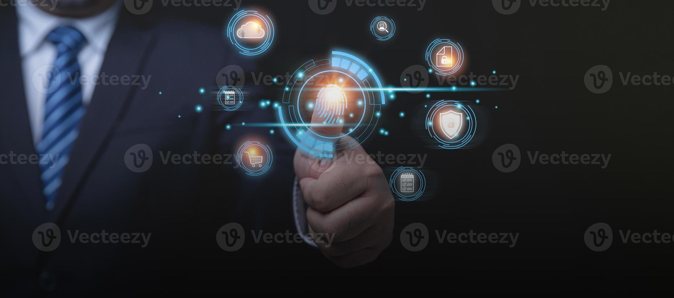 Businessman login by finger scan for protecting business data, and personal information from hackers. Use technology, cyber security data concept. IOT and internet technology. photo