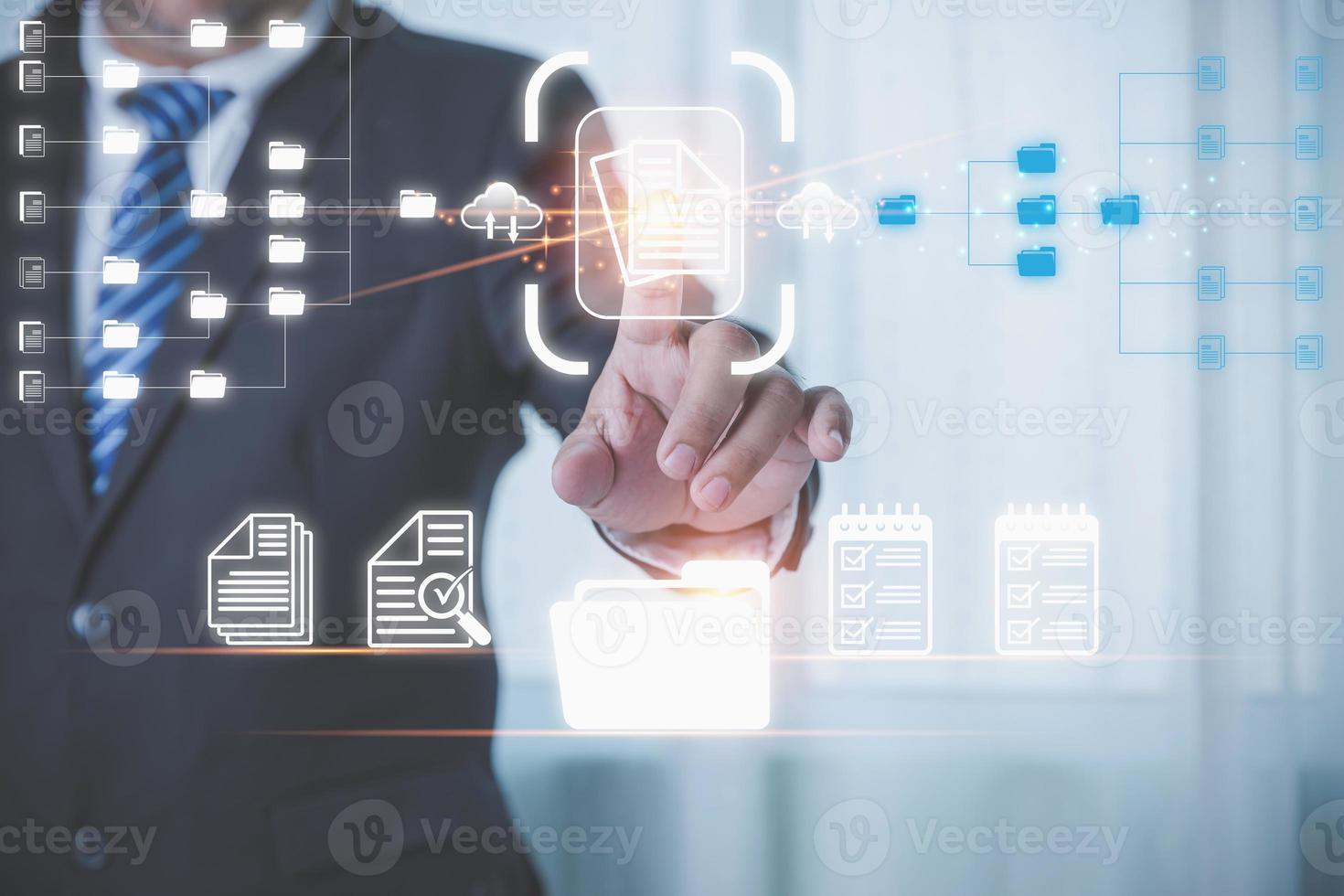 Businessman manager touching the virtual screen to document for management concept. Document management system DMS. Management of documentation online, and digital file storage system or software. photo