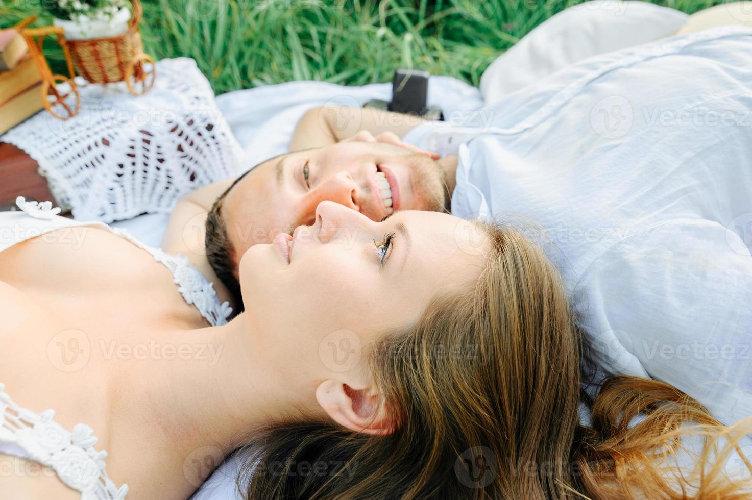 happy couple have fun in the park on nature. photo