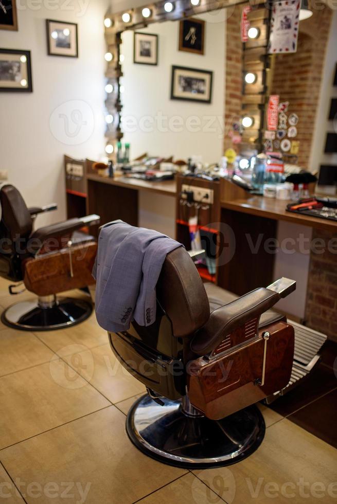 Businessman suit on armchair in barbershop. Opening a small business after quarantine. photo