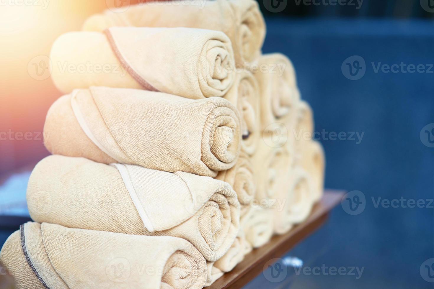 Pile of towel for swimming pool service or training or after exercise or aroma therapy massage photo