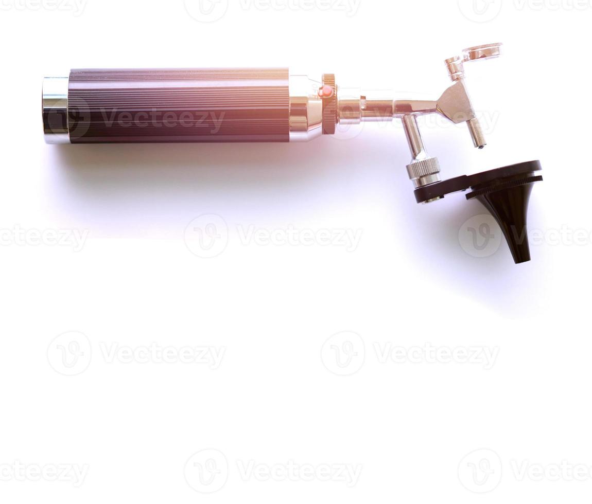 Otoscope and hammer jerk on floor ,top view photo