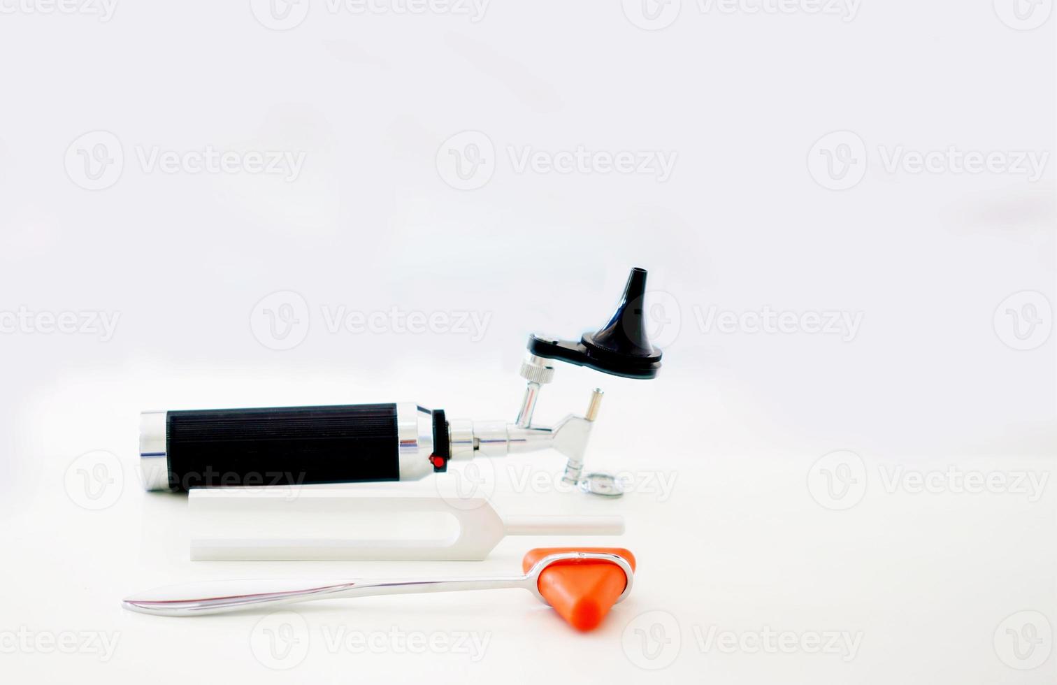 Tuning fork,Otoscope and hammer jerk on floor ,top view with copy space photo