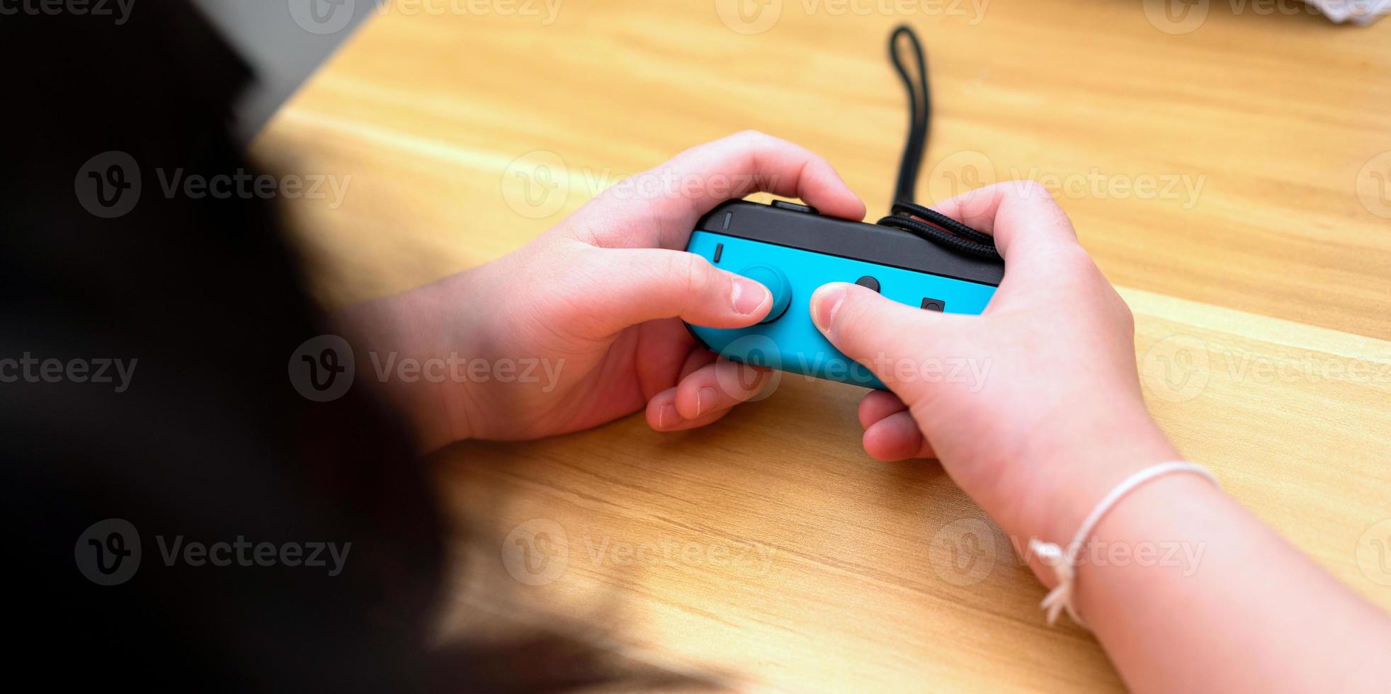 kid play game controller photo