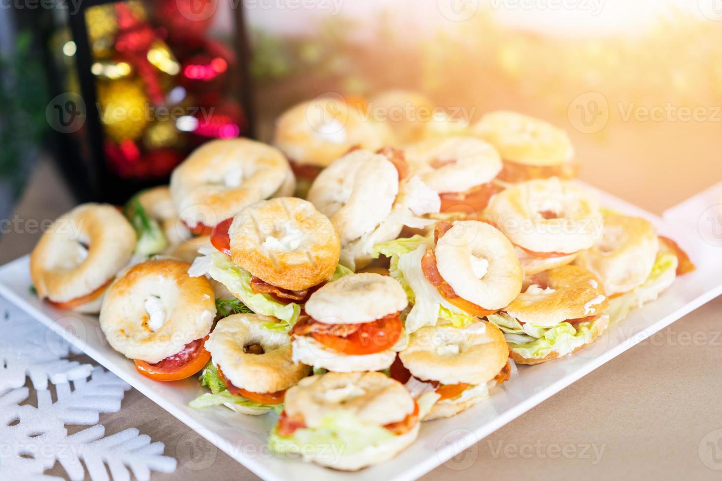 christmas snack donit bread with meat and vetgy with blur decorate red and yellow background photo