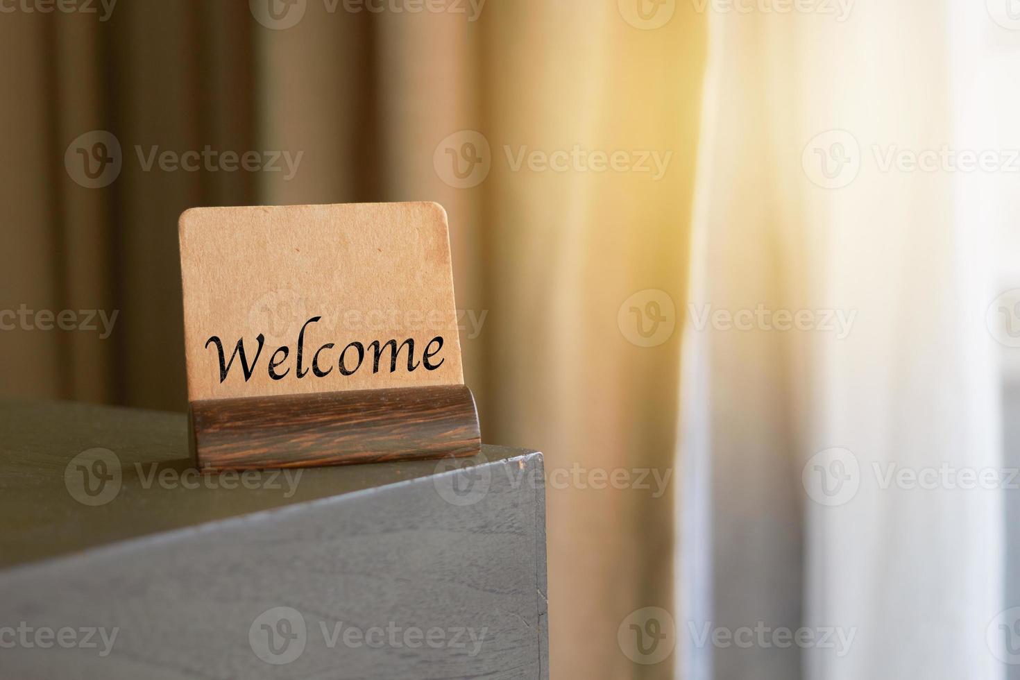 welcome sign on table photo