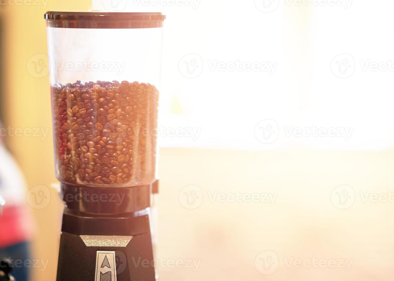 coffee beans in Blend container machine in coffee shop photo