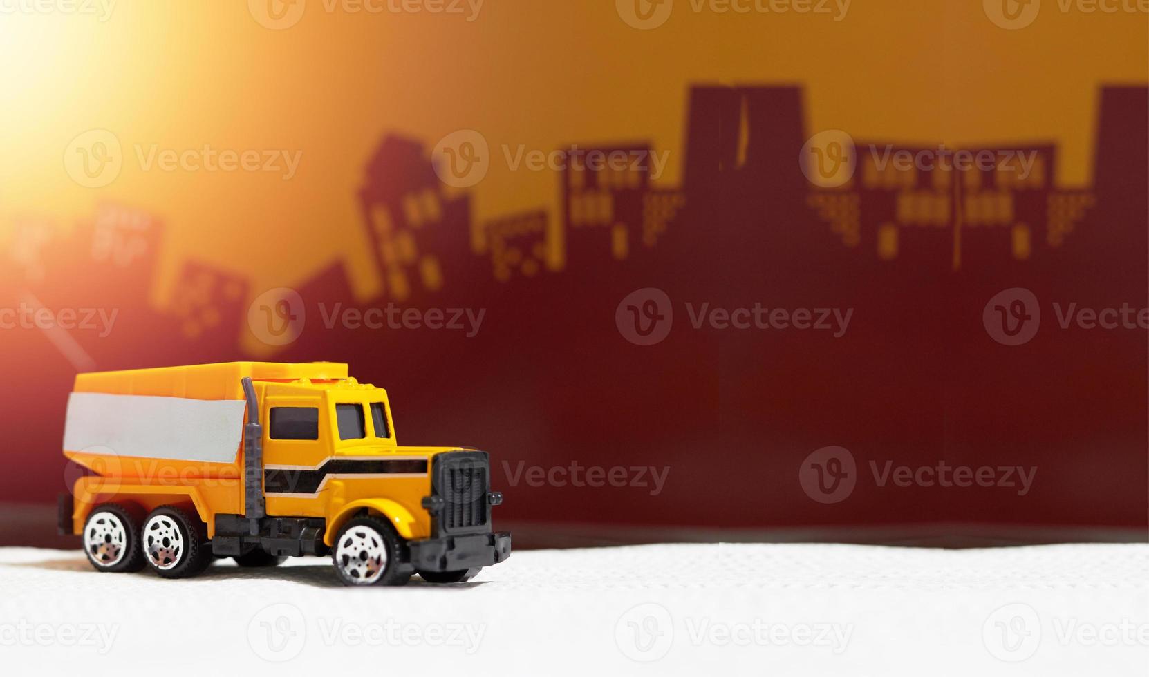 dumper truck car toy on blur city background.jpg photo