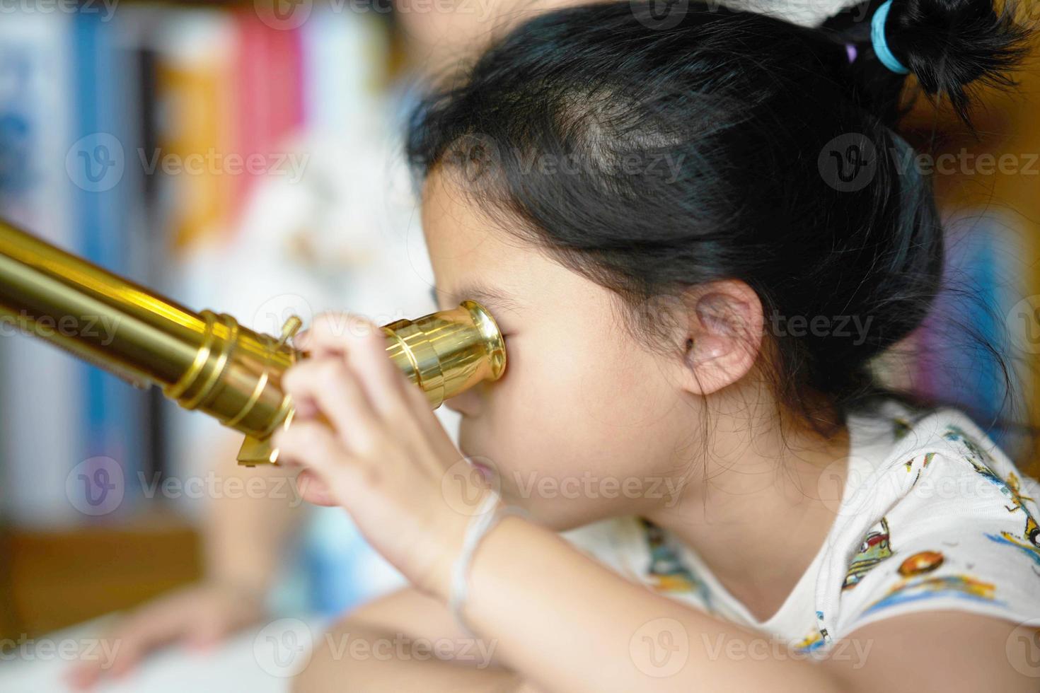 Girl use telescope alone photo