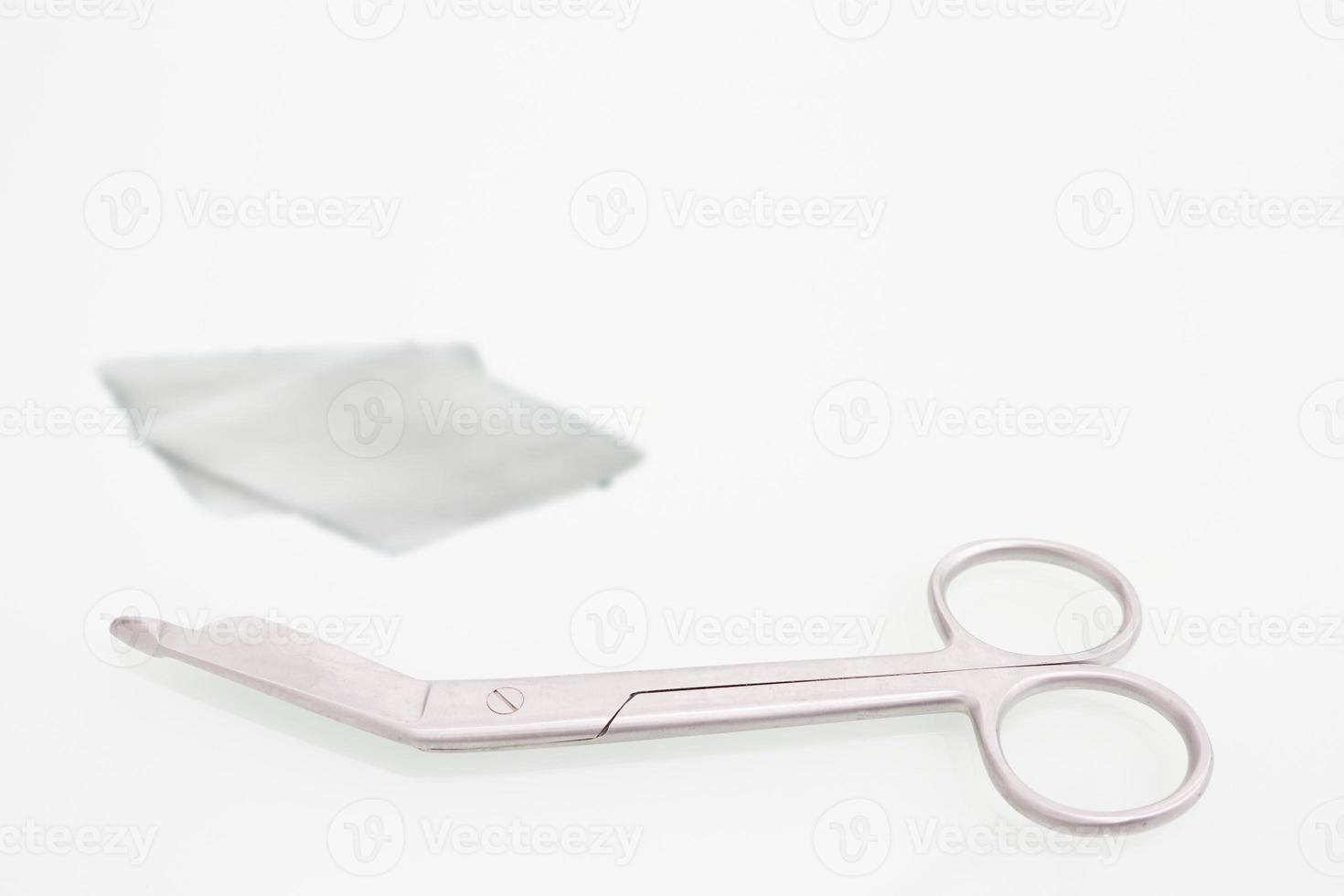 Guaze cutting scissors on copy space photo