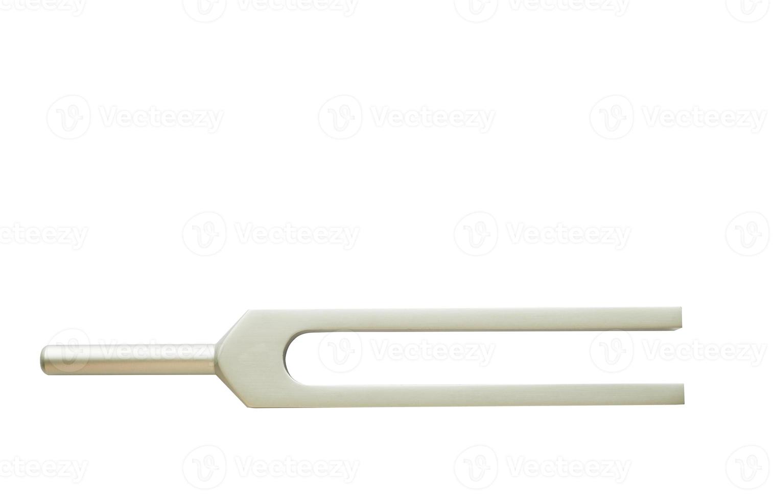 Tuning fork for ear test of ENT doctor or sound wave maker on isolated  white background photo